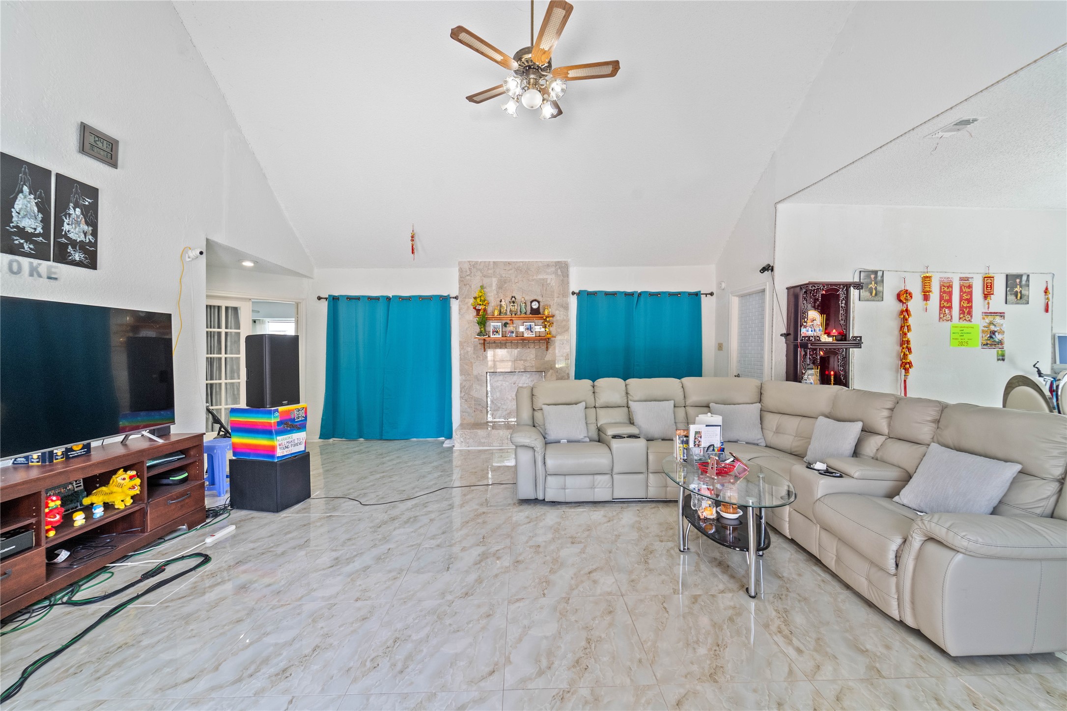 6331 Modesto Drive Houston, TX 77083 - Photo 5 of 31 a living room with furniture and a flat screen tv