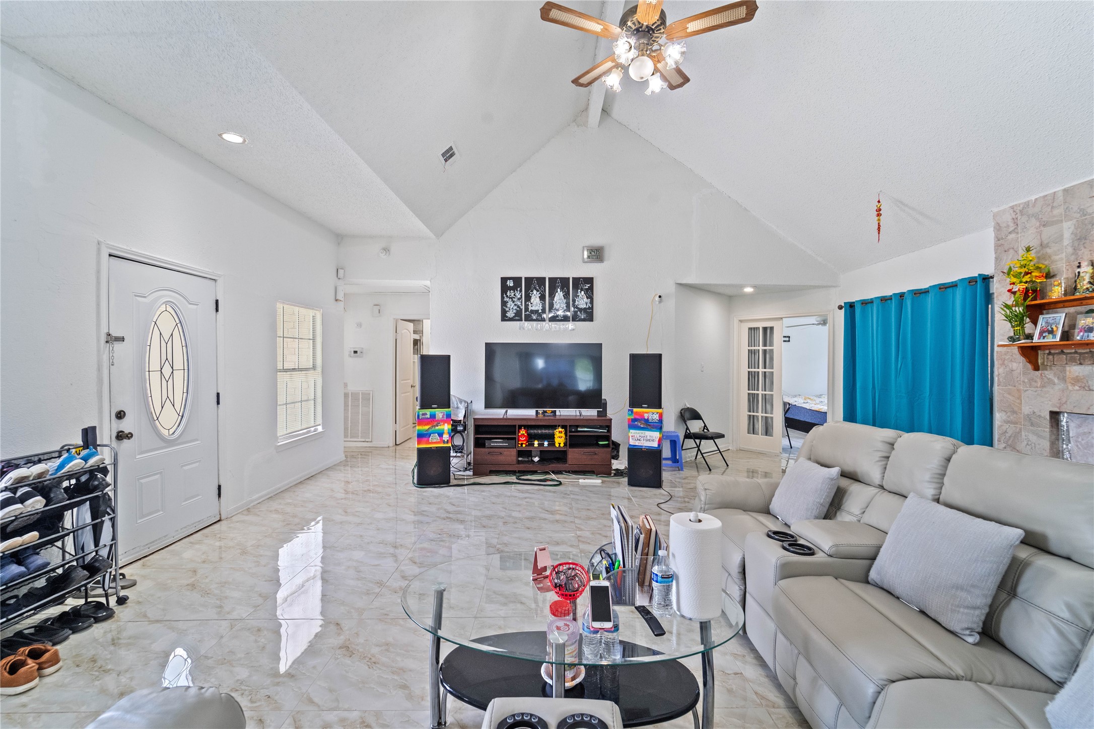 6331 Modesto Drive Houston, TX 77083 - Photo 7 of 31 a living room with furniture and a flat screen tv