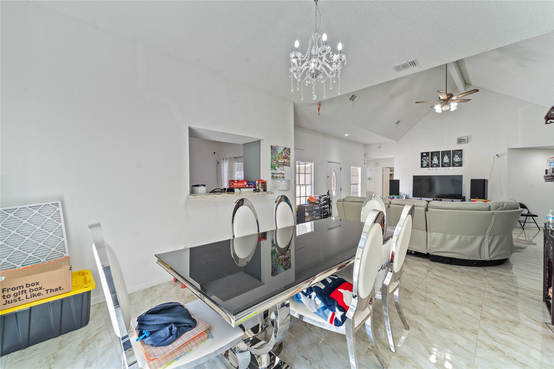 6331 Modesto Drive Houston, TX 77083 - Photo 10 of 31 a living room with furniture and a chandelier