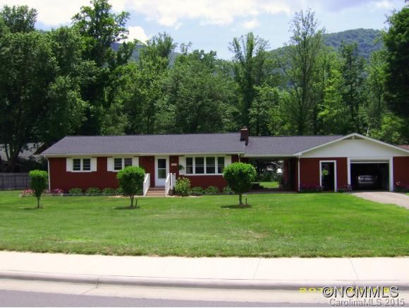 1105 Moody Farm Road Maggie Valley, NC 28751 - Photo 1 of 22 a front view of a house with a yard and trees