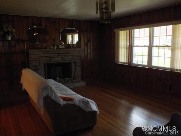1105 Moody Farm Road Maggie Valley, NC 28751 - Photo 2 of 22 a living room with furniture and a fireplace