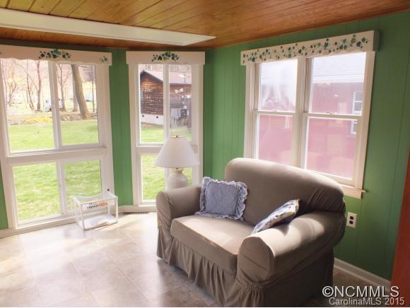 1105 Moody Farm Road Maggie Valley, NC 28751 - Photo 16 of 22 a living room with furniture and a large window