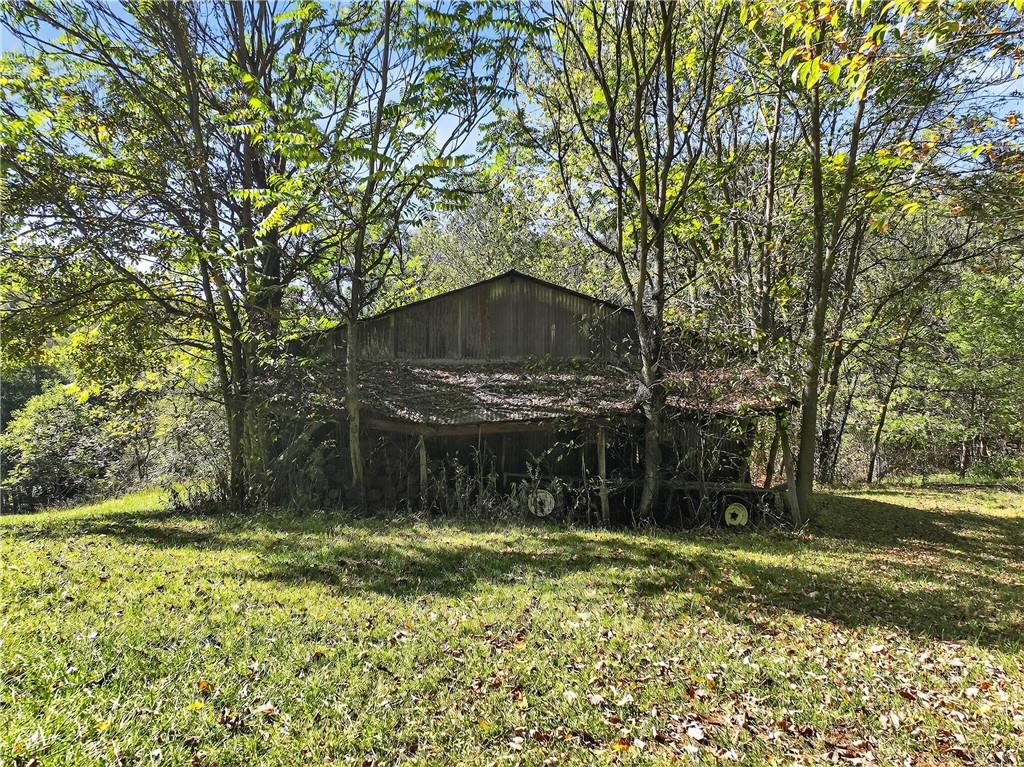 82 Phillips Road Burgettstown, PA 15021 - Photo 11 of 49 a backyard of a house with lots of green space