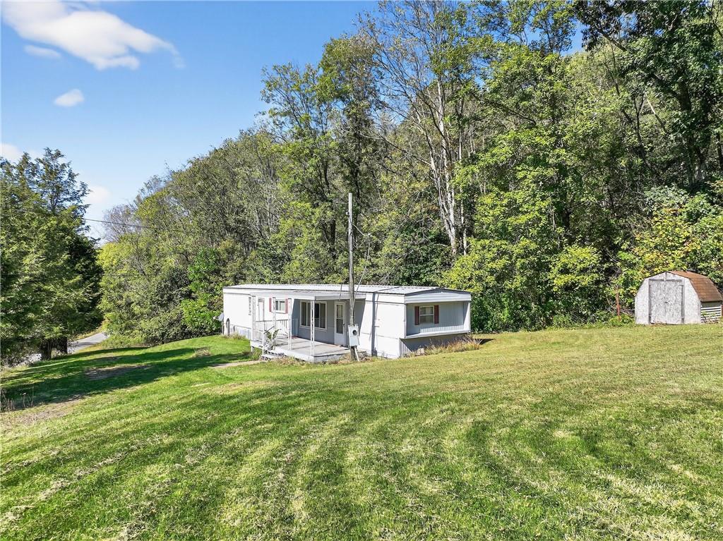 82 Phillips Road Burgettstown, PA 15021 - Photo 17 of 49 a view of a house with a yard and sitting area