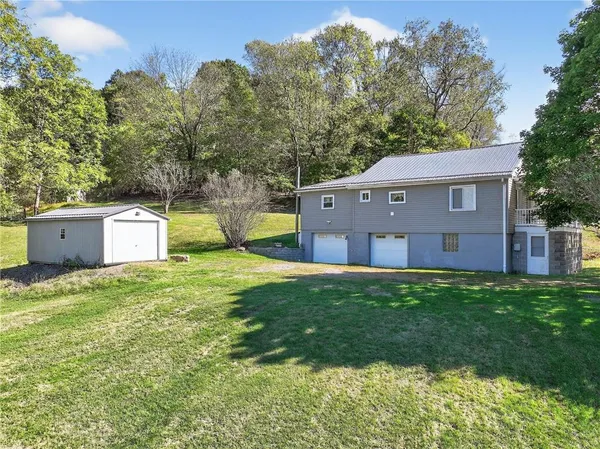 a house view with a garden space