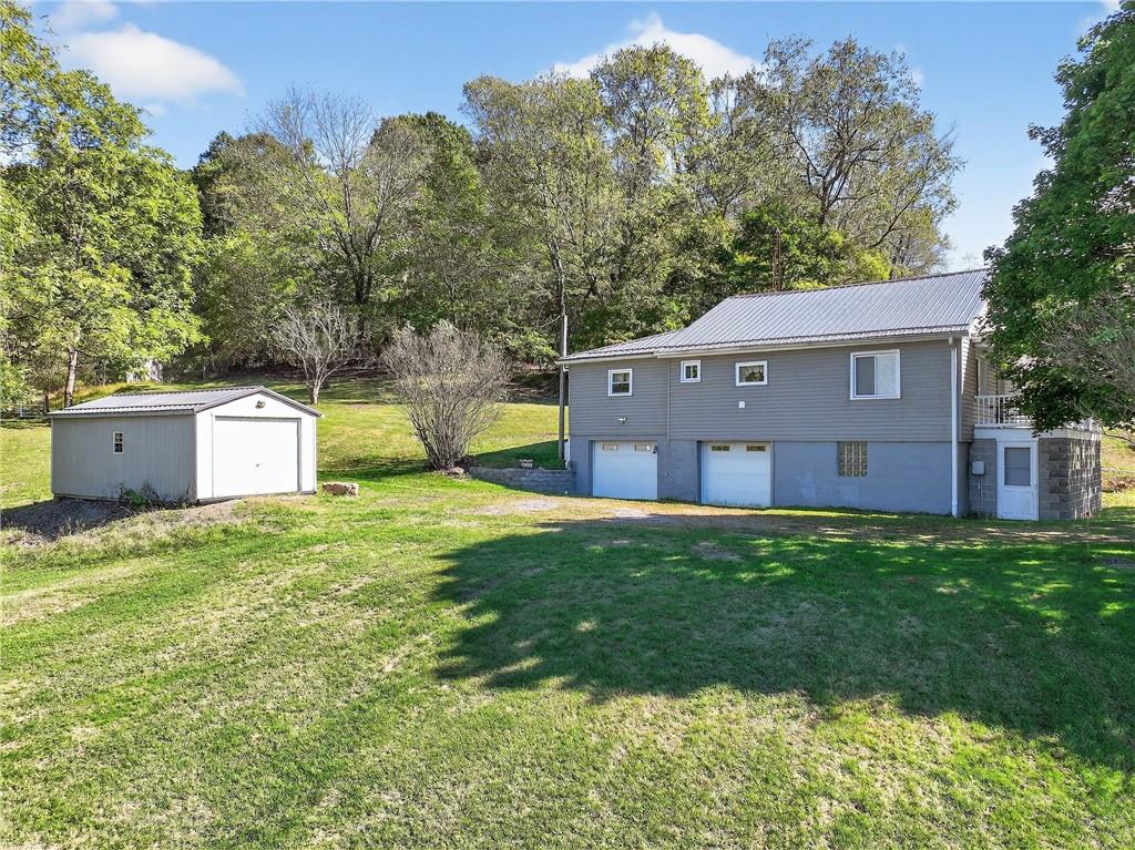 82 Phillips Road Burgettstown, PA 15021 - Photo 2 of 49 a house view with a garden space