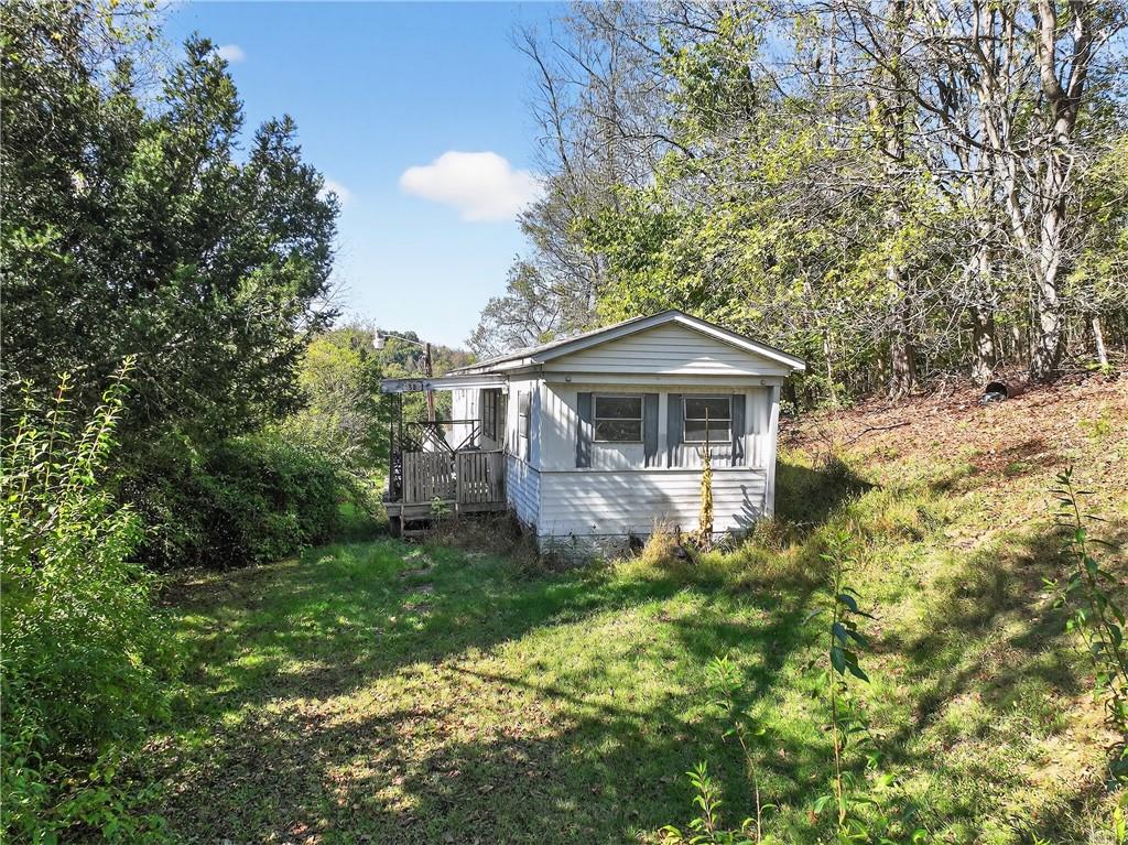 82 Phillips Road Burgettstown, PA 15021 - Photo 21 of 49 a front view of a house with garden
