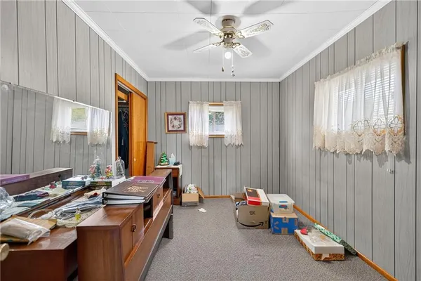 a view of a kids room with furniture window and outside view