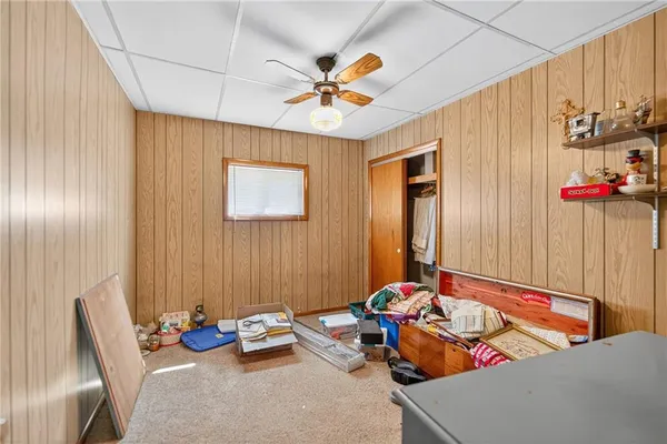 a bedroom with furniture and a window