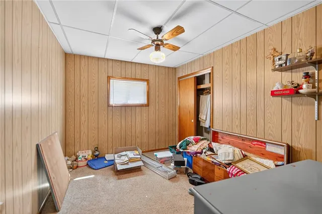 a bedroom with furniture and a window