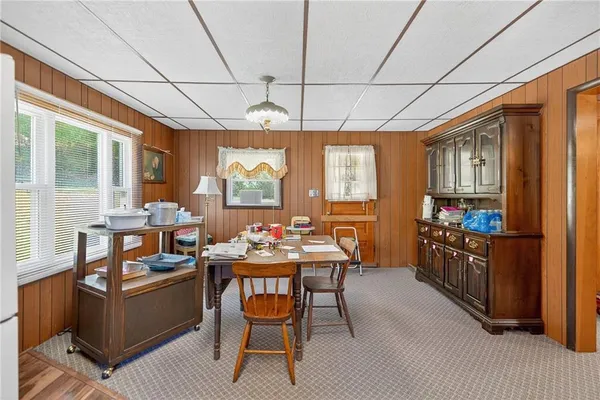a dining room with furniture and window