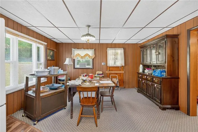 a dining room with furniture and window