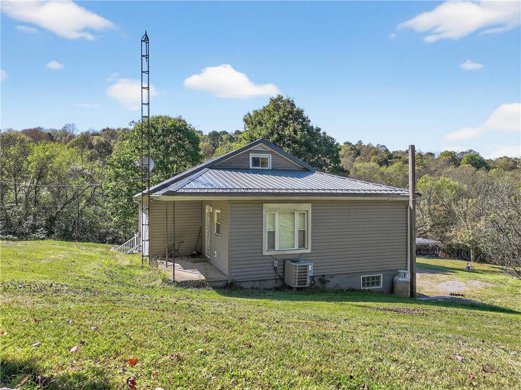 82 Phillips Road Burgettstown, PA 15021 - Photo 5 of 49 a front view of a house with a yard