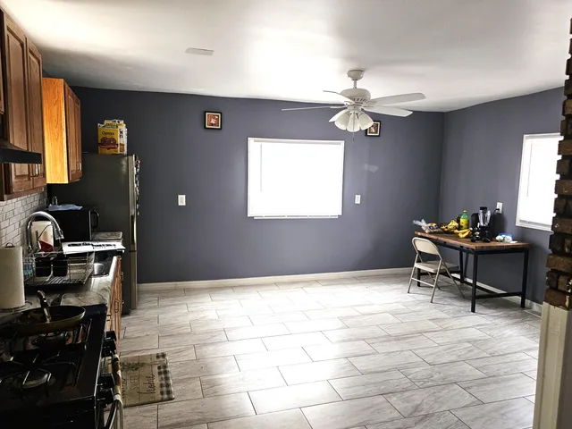 a view of a workspace with furniture