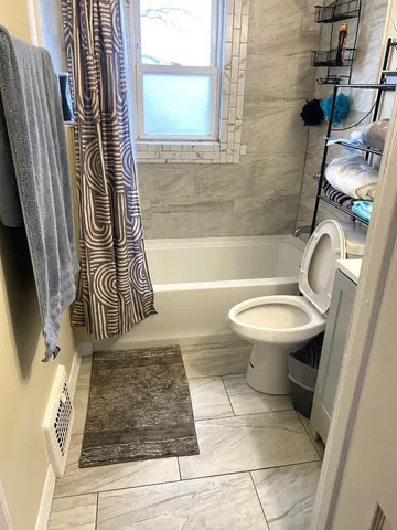 a bathroom with a toilet a sink and a bathtub