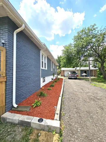 a view of a back yard of the house