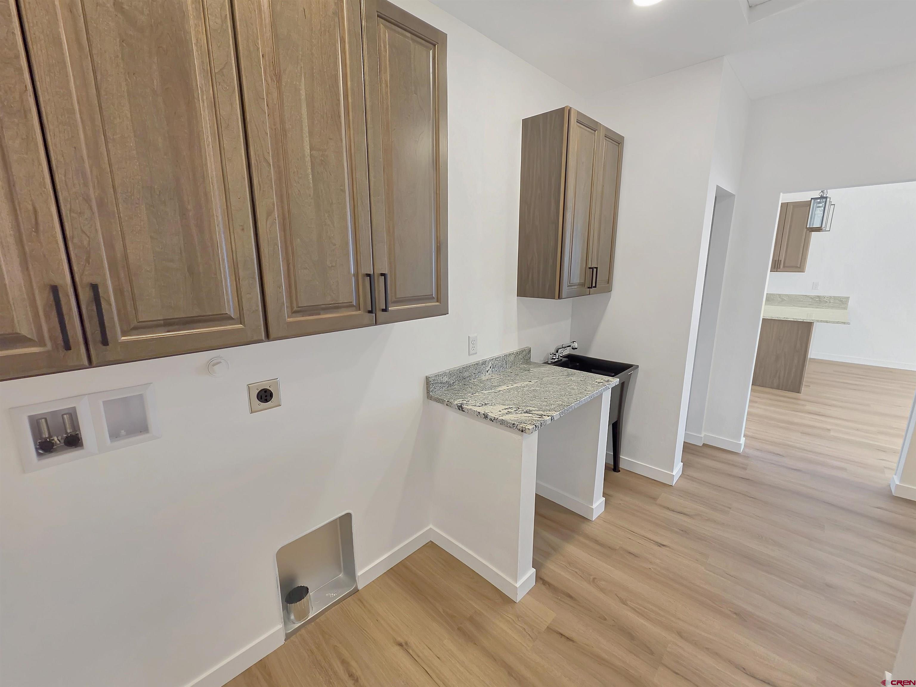 1456 Acoma Street Cortez, CO 81321 - Photo 19 of 26 a room with a sink and a mirror
