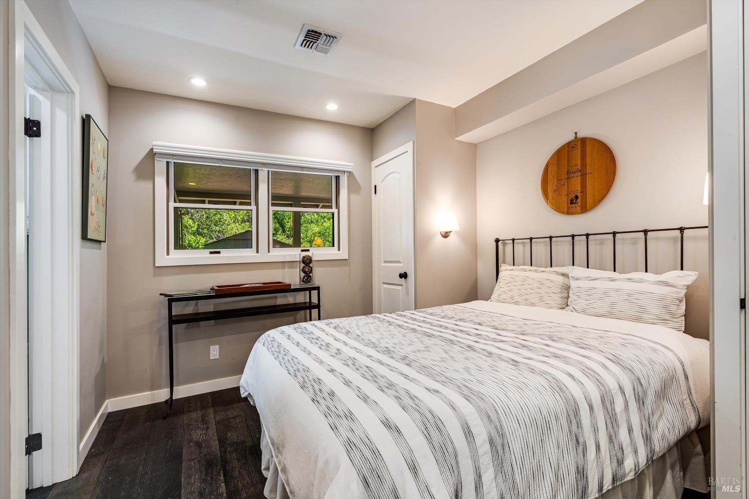 850 Conn Valley Road St. Helena, CA 94574 - Photo 13 of 79 a bedroom with a bed and a window