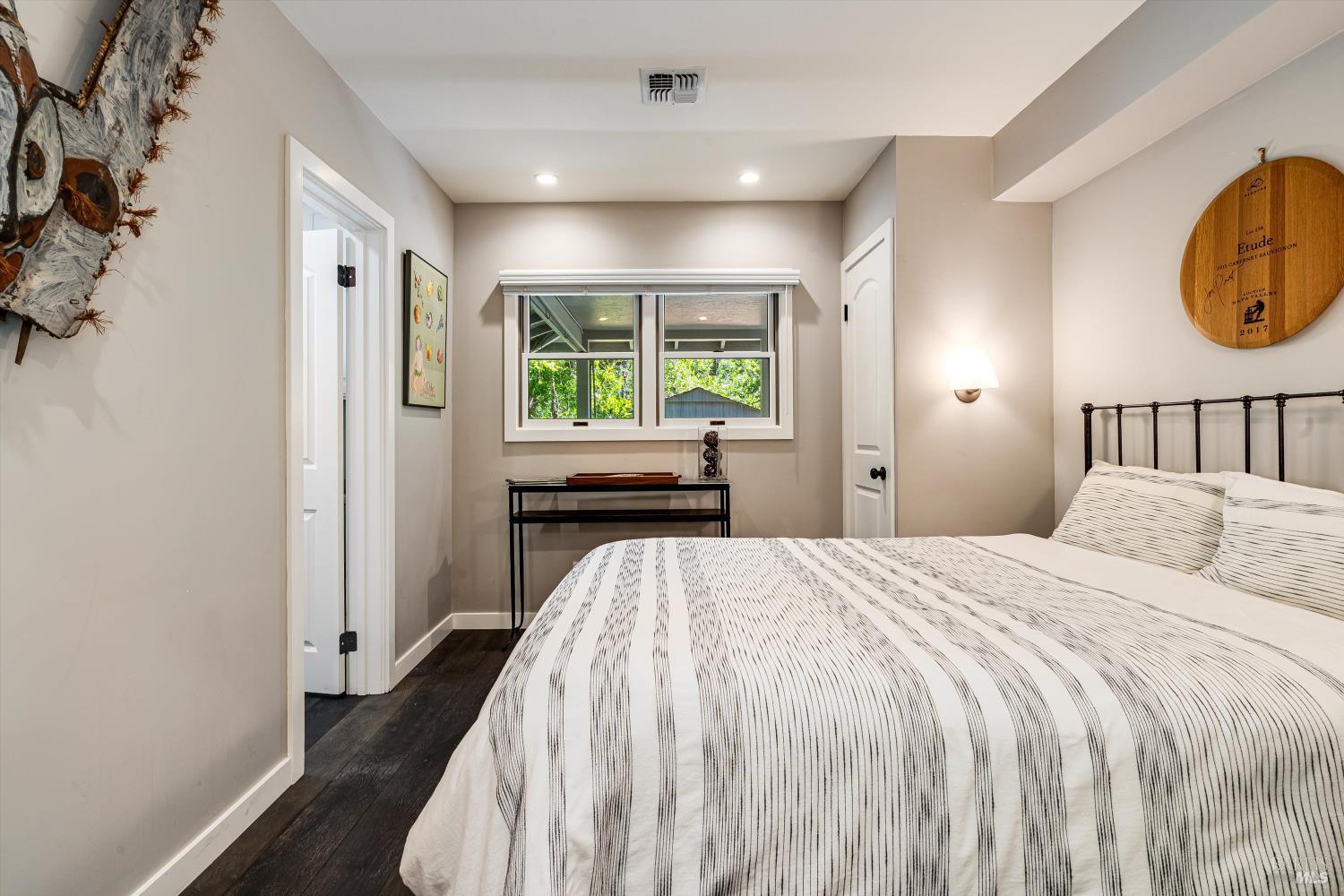 850 Conn Valley Road St. Helena, CA 94574 - Photo 14 of 79 a bed sitting in a spacious bedroom next to a window