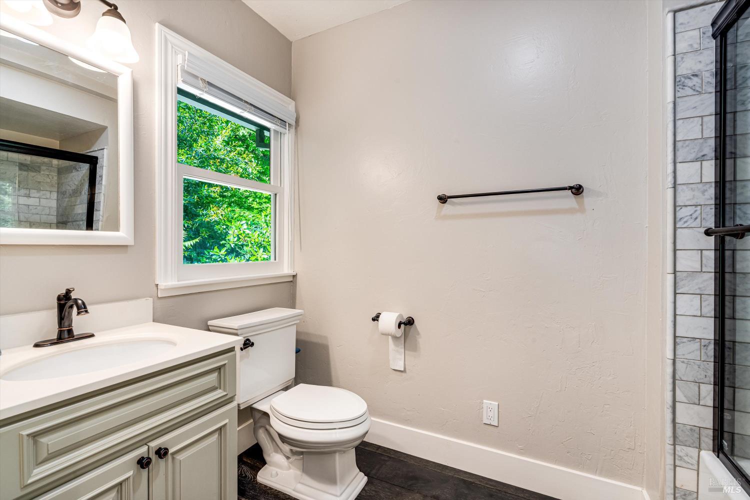 850 Conn Valley Road St. Helena, CA 94574 - Photo 21 of 79 a bathroom with a sink a toilet and a window