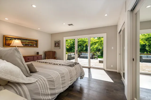 a bathroom with a shower sink and mirror
