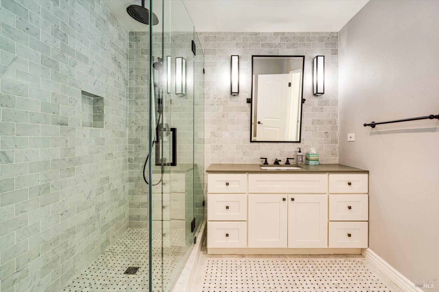 850 Conn Valley Road St. Helena, CA 94574 - Photo 26 of 79 a bathroom with a sink a vanity and shower