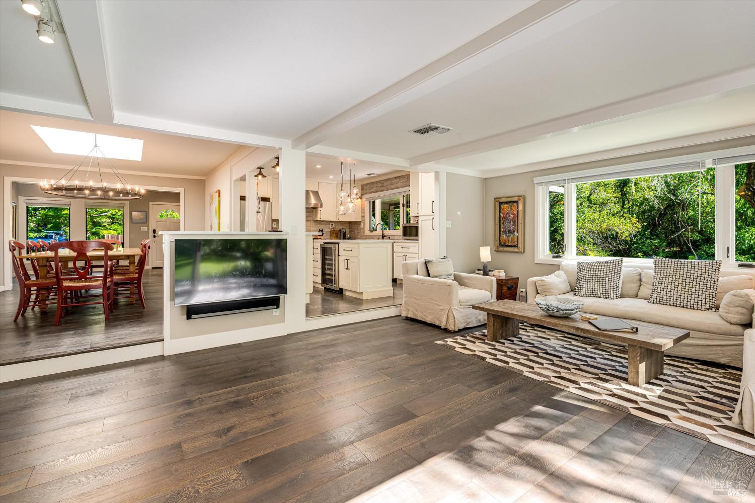 850 Conn Valley Road St. Helena, CA 94574 - Photo 29 of 79 a living room with furniture large window and a fireplace