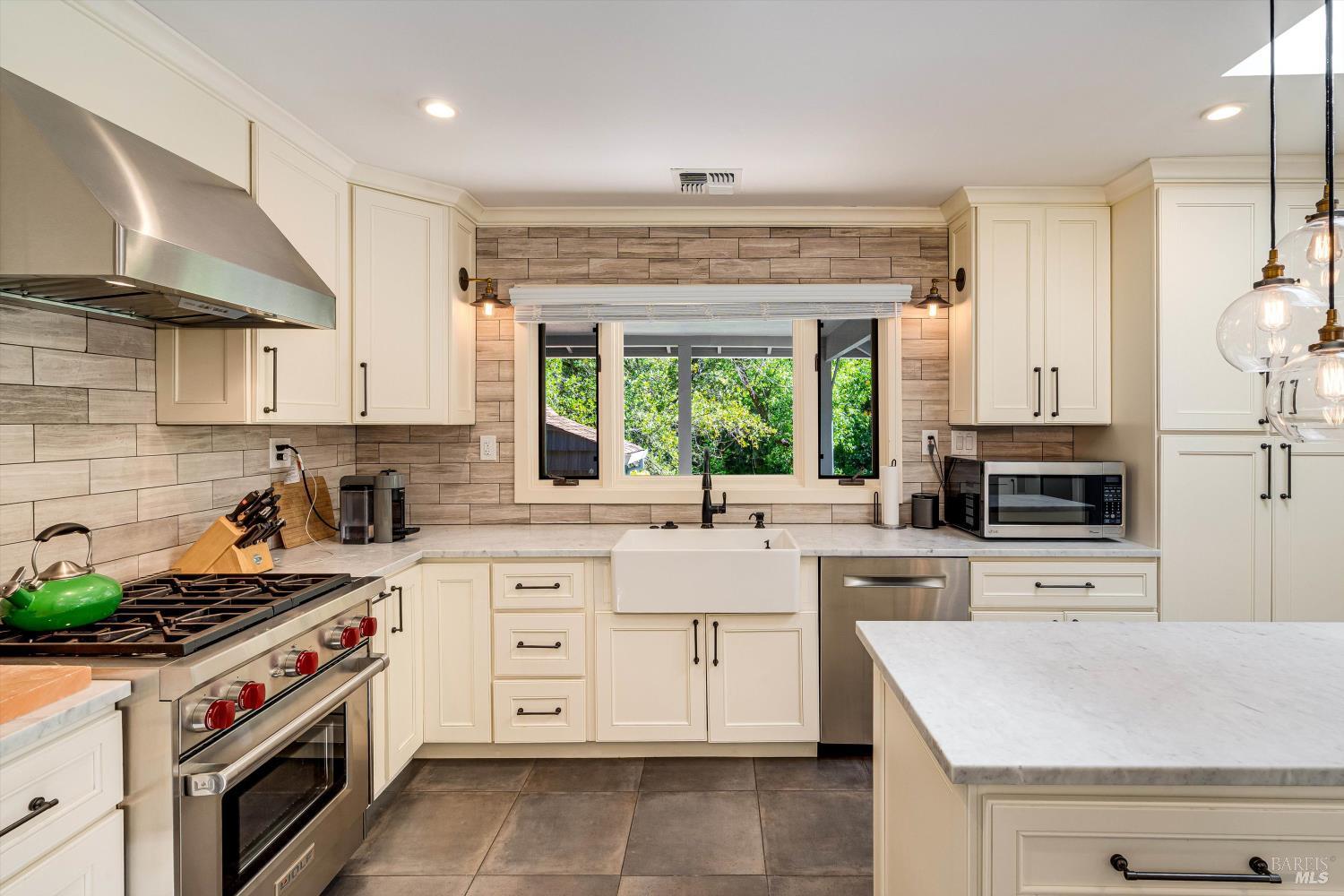 850 Conn Valley Road St. Helena, CA 94574 - Photo 36 of 79 a kitchen with a stove a sink and a refrigerator