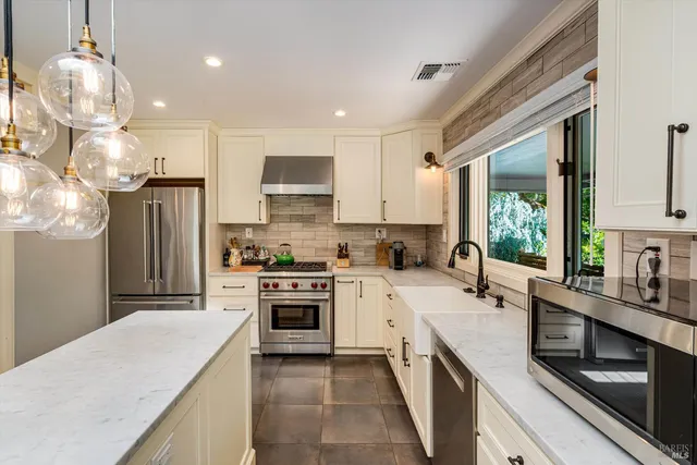 a view of a backyard with sitting area