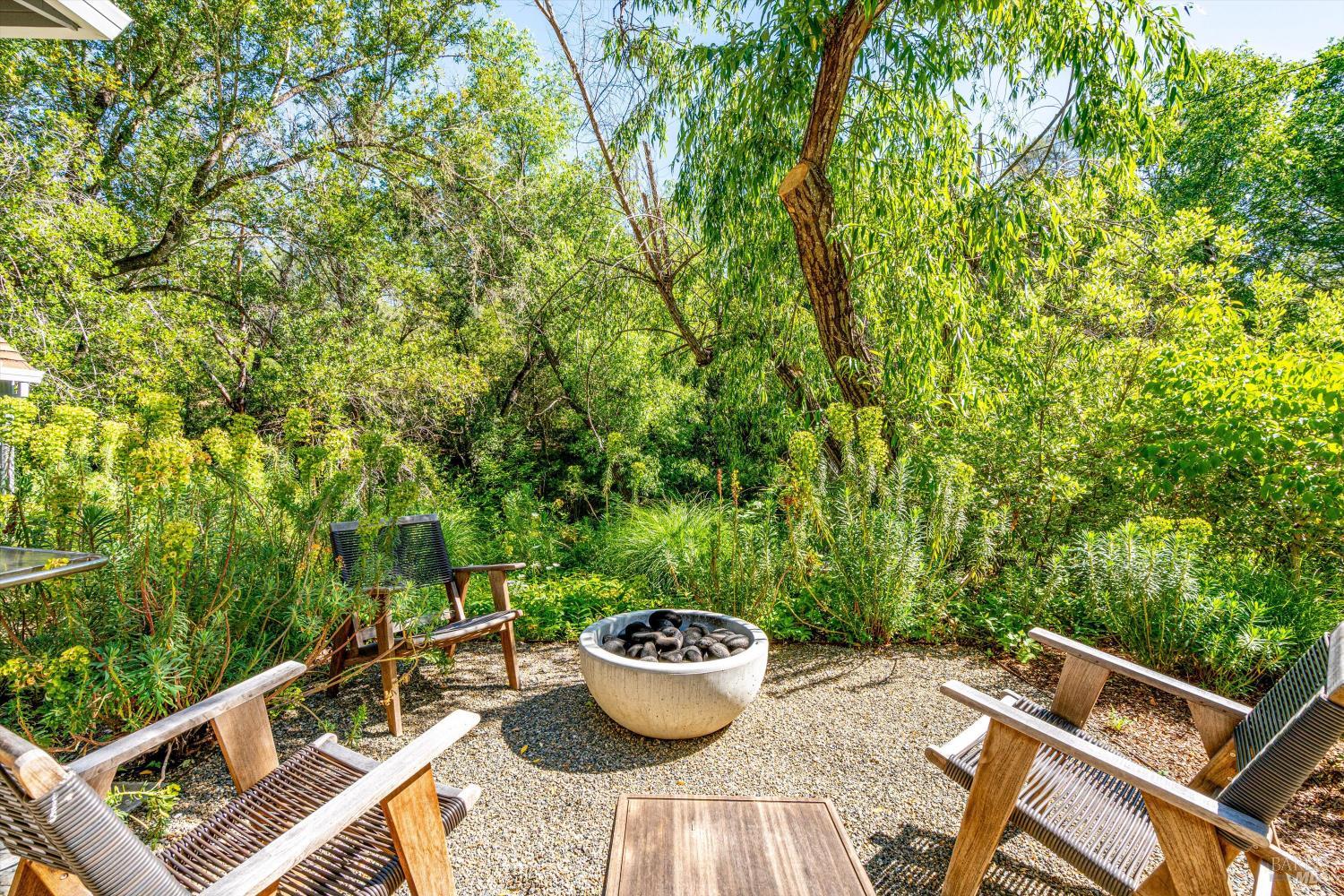 850 Conn Valley Road St. Helena, CA 94574 - Photo 43 of 79 a view of a balcony with chair and potted plants