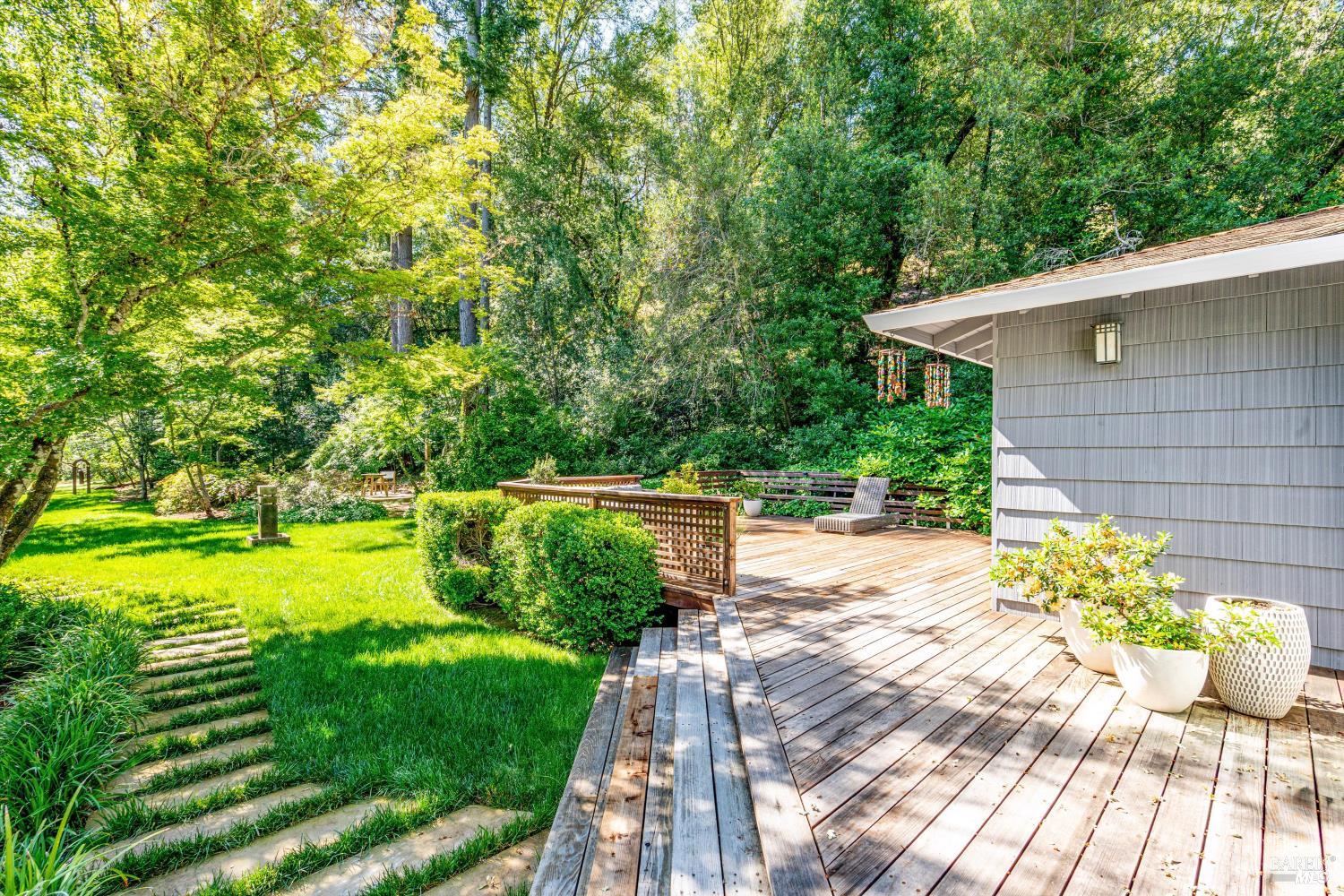 850 Conn Valley Road St. Helena, CA 94574 - Photo 44 of 79 a view of a backyard with plants and large trees