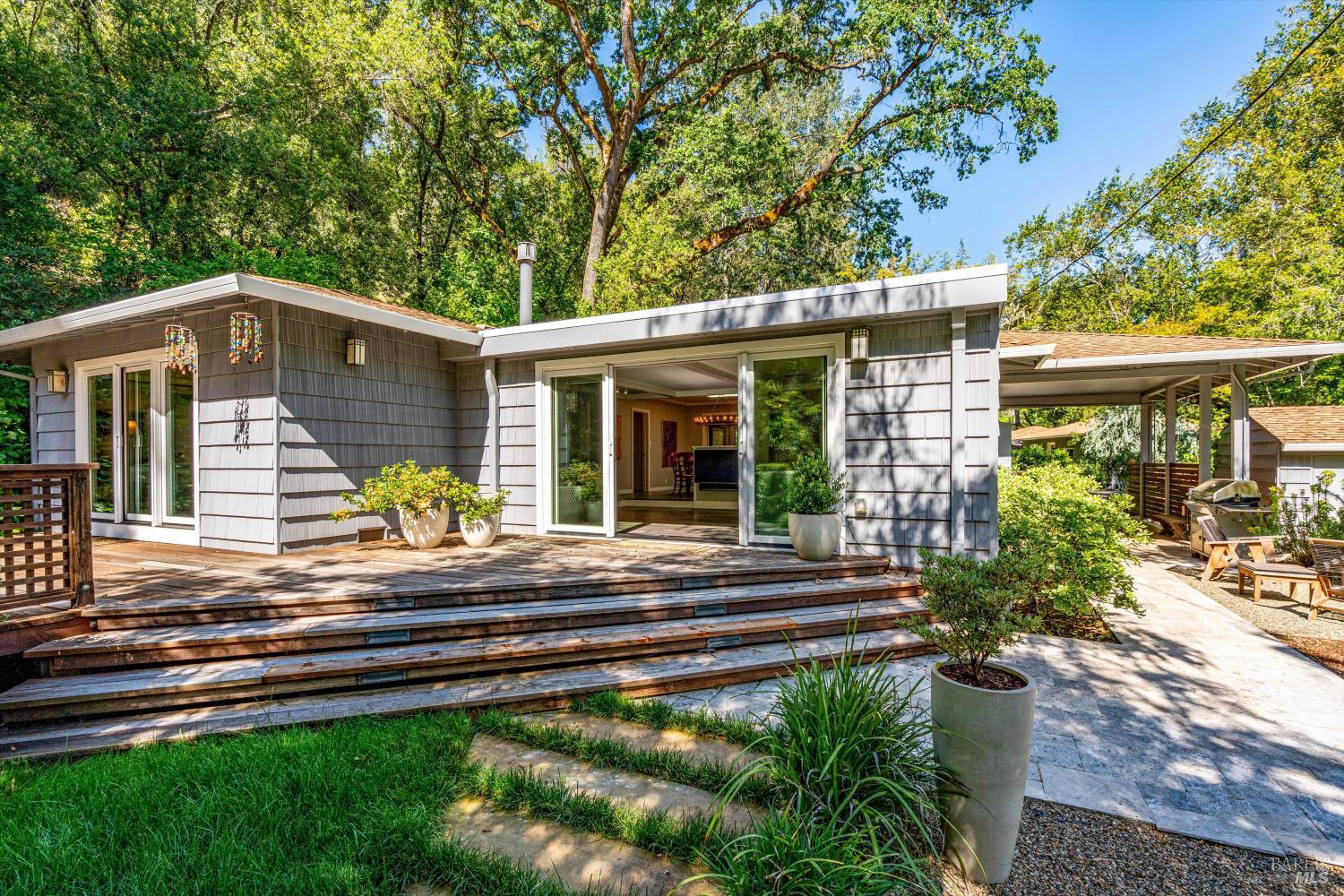850 Conn Valley Road St. Helena, CA 94574 - Photo 45 of 79 a front view of a house with a yard porch and outdoor seating