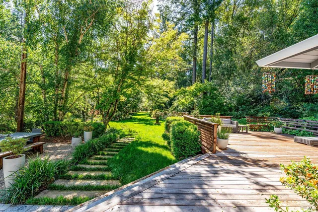 a balcony with view of trees in front of it