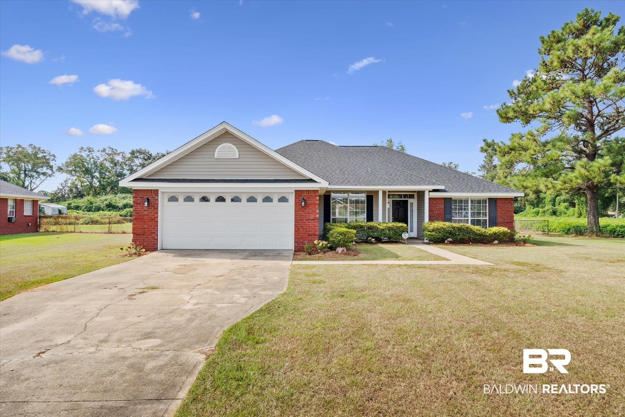 9939 Dreamway Drive Chunchula, AL 36521 - Photo 1 of 45 Single story home featuring a garage and a front lawn