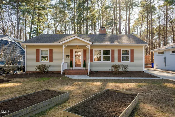 a front view of a house with yard