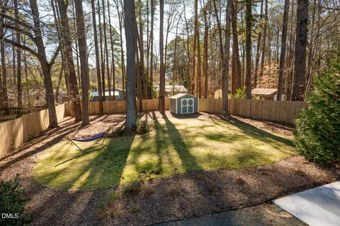 a view of swimming pool with chairs and tables