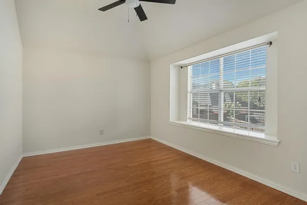 an empty room with a empty space and windows