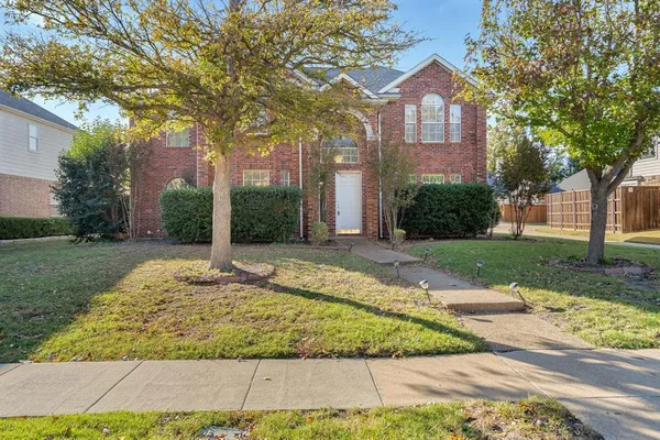 a house with yard in front of it