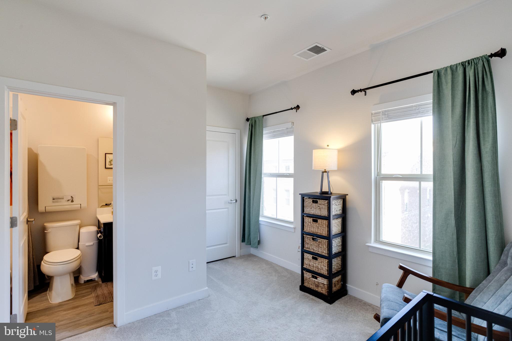 216 South Newkirk Street Baltimore, MD 21224 - Photo 25 of 35 Second Bedroom with Attached Bathroom