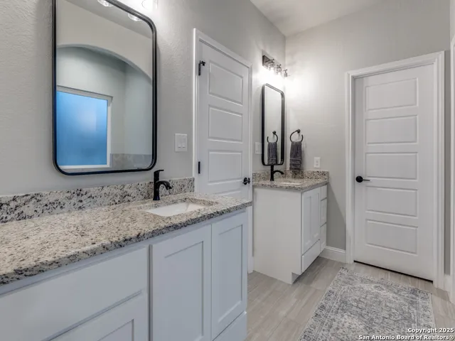 a white bath tub sitting in a bathroom