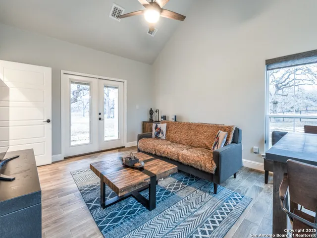 a bathroom with a granite countertop sink a vanity and a shower