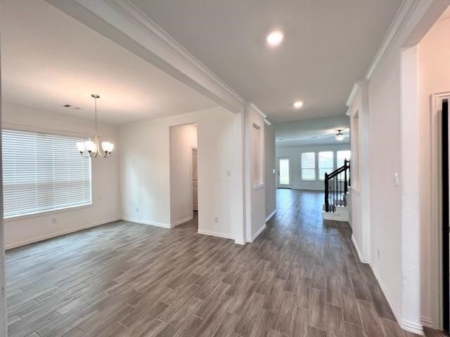 4826 Albany Ridge Lane Rosharon, TX 77583 - Photo 4 of 37 a view of a hallway with wooden floor