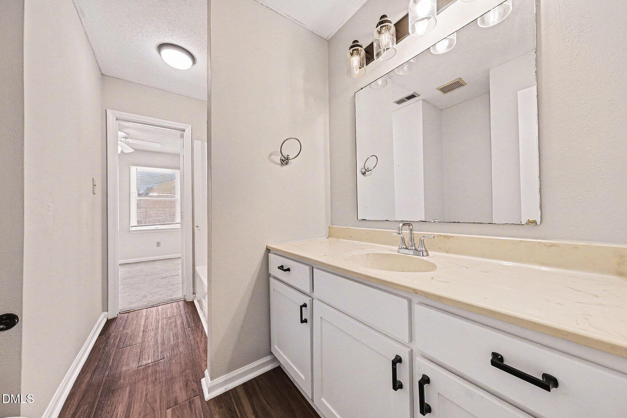 1509 Clermont Road, Unit T27 Durham, NC 27713 - Photo 11 of 26 a bathroom with a sink and a mirror