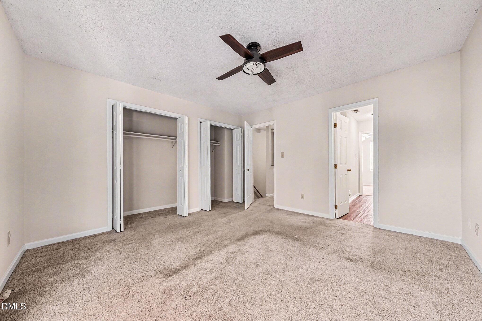 1509 Clermont Road, Unit T27 Durham, NC 27713 - Photo 13 of 26 a view of a livingroom with a ceiling fan & entryway