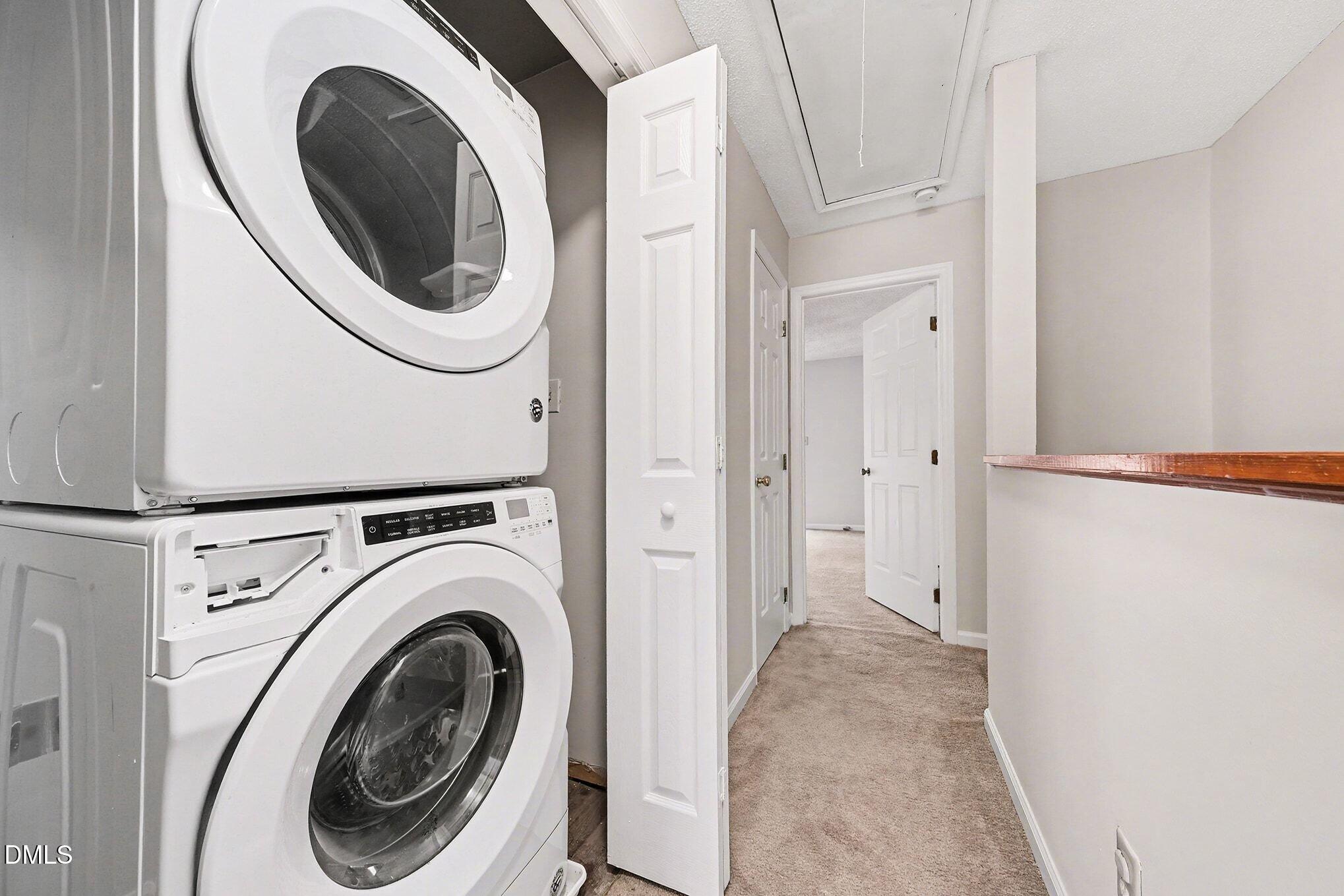 1509 Clermont Road, Unit T27 Durham, NC 27713 - Photo 18 of 26 a view of a hallway with washer and dryer