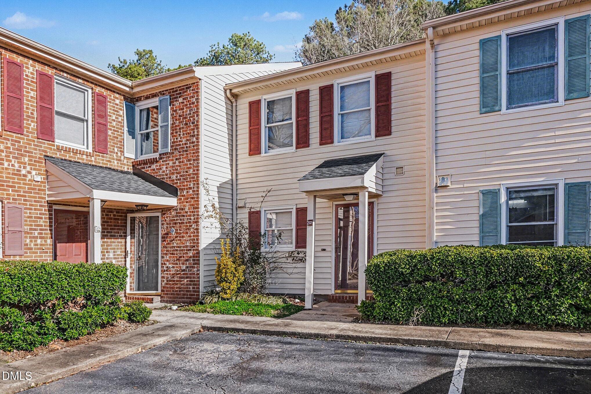1509 Clermont Road, Unit T27 Durham, NC 27713 - Photo 2 of 26 a front view of a house with garden