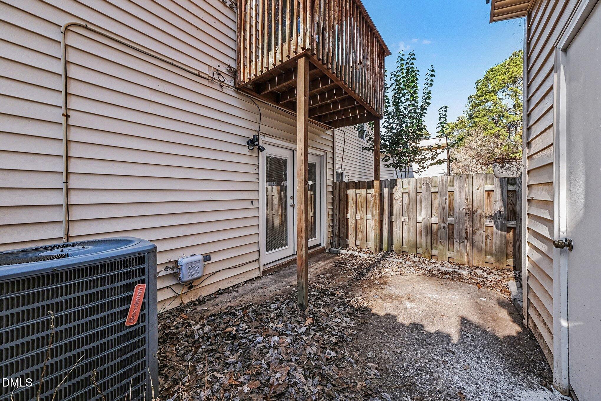 1509 Clermont Road, Unit T27 Durham, NC 27713 - Photo 22 of 26 a view of a house with a door and wooden walls