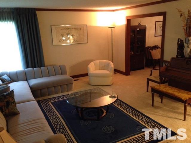 8908 Woodvine Court Raleigh, NC 27613 - Photo 2 of 8 a living room with furniture