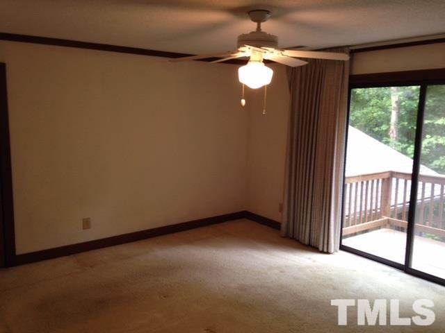 8908 Woodvine Court Raleigh, NC 27613 - Photo 6 of 8 a view of an empty room with a window