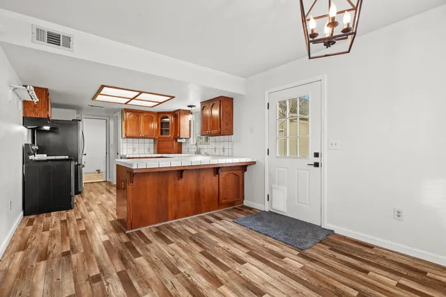 a kitchen with stainless steel appliances granite countertop a sink and cabinets